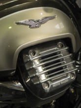 Close-up of a Moto Guzzi engine with a logo and chrome accents, dortmund, germany