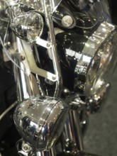 Reflective chrome details of a motorbike with headlight, dortmund, germany
