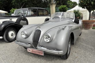 Grey Jaguar convertible with curved lines and elegant classic car style, Retro Classics meets