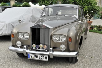 Grey classic Rolls-Royce vintage car with badge on the radiator grille, Retro Classics meets