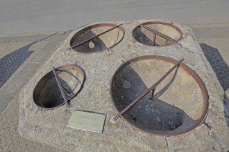Historic grain stone from 1525, calibration measure for grain, four semicircular holes for