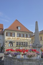 Historic Hotel and Restaurant Schlundhaus, obelisk fountain, market fountain, flower decoration,