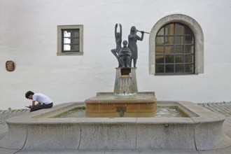 Fountain for civil servants with sculptures Modern art, book reader, flute player, fountain for