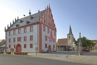 Old town hall built in 1719 with stepped gable and St Kilian's Church, market square, Haßfurt,