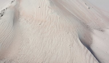 Full frame abstract sand background in sunny ambiance