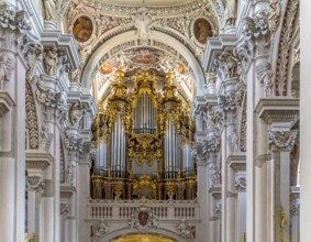 Frontal shot of a rich ornamented church organ