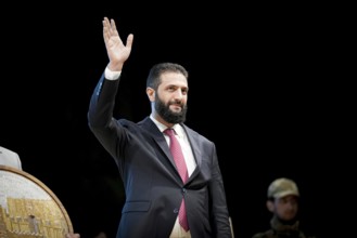 Syrian interim president Ahmad Al-Sharaa attends a public celebration in Damascus after the fall of