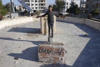Syrians are seen destroying statues and regime symbols in Damascus after the fall of Bashar