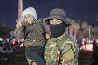 Thousands of Syrians take to public squares and main streets waving the revolutionary flag and