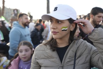 Thousands of Syrians take to public squares and main streets waving the revolutionary flag and