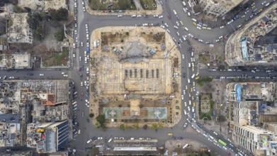 Aerial view shows Syrian public security forces staging a public parade in central Aleppo following