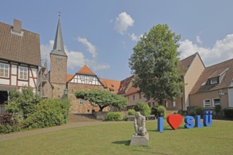Heart sign as a symbol of solidarity and love for the city of SLÜ, monument to medieval humanist,