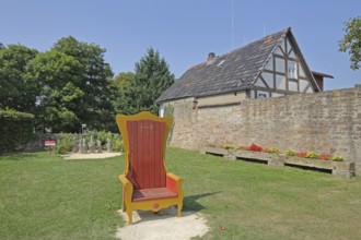 Red golden throne in the inner courtyard, garden, museum, Brothers Grimm House, Steinau an der