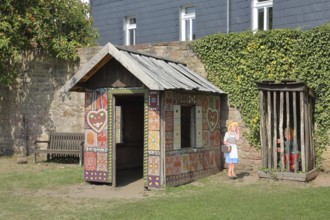 Gingerbread house for the fairy tale Hansel and Gretel, fairy tale figures, hut, wooden posts,