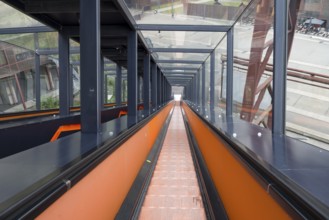Orange escalator descending, visitor centre, Ruhr Museum, Zeche Zollverein, UNESCO World Heritage