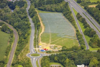 Aerial view, field with construction site for ground-mounted photovoltaic plant solar park at the
