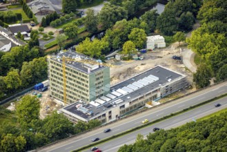 Aerial view, Arnsberg town hall on the A46 motorway, construction site with new building, Neheim,