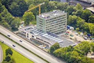 Aerial view, Arnsberg town hall on the A46 motorway, construction site with new building, Neheim,