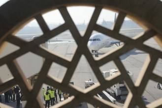 Passengers celebrate with Syrian revolutionary flags as the first flight lands at Aleppo