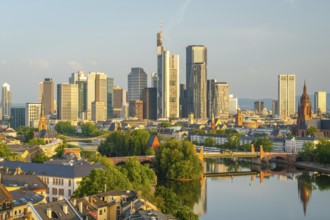 Frankfurt City Skyline, Residential Buildings, Bridges and Main River on Sunny Morning. Aerial View