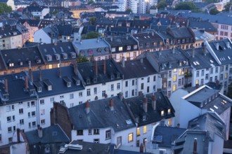 Old Residential Buildings in Frankfurt City at Evening Twilight with Illuminated Windows. Aerial