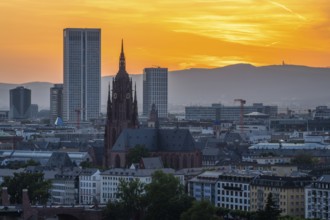 Frankfurt Cathedral, Residential Buildings and City at Fiery Sunset. Aerial View. Golden Hour.