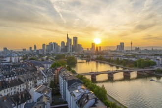 Frankfurt City Downtown, Residential Buildings, Bridges and Main River at Sunset. Wide Shot. Aerial
