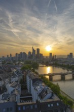 Frankfurt City Skyline, Residential Buildings, Bridges and Main River at Sunset. Wide Shot. Aerial