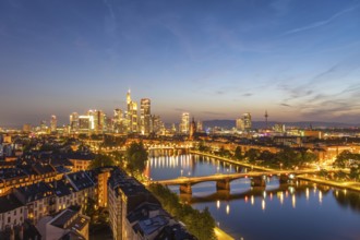 Illuminated Frankfurt City Downtown, Residential Buildings, Bridges and Main River at Night. Wide