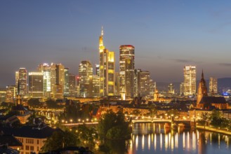 Illuminated Frankfurt Downtown Skyscrapers, Residential Buildings, Bridges and Main River at Night.
