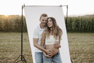 Pregnant, young woman with partner
