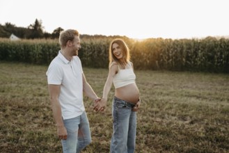 Pregnant, young woman with partner