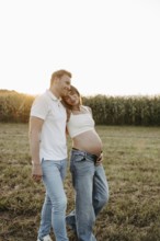 Pregnant, young woman with partner