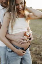 Pregnant, young woman with partner