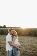 Pregnant, young woman with partner