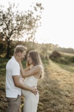 Pregnant, young woman with partner