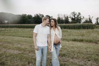 Pregnant, young woman with partner
