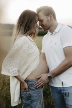 Pregnant, young woman with partner