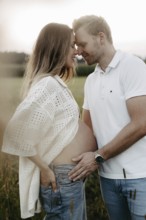Pregnant, young woman with partner