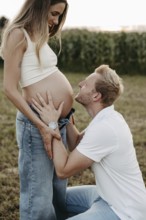 Pregnant, young woman with partner