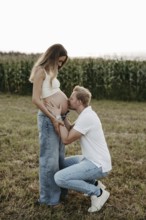 Pregnant, young woman with partner