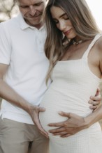 Pregnant, young woman with partner