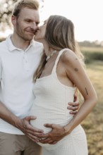 Pregnant, young woman with partner