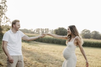 Pregnant, young woman with partner