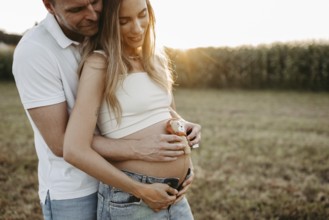 Pregnant, young woman with partner