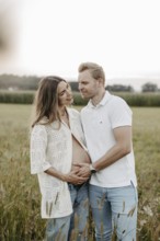 Pregnant, young woman with partner