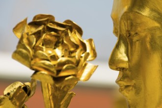 Golden Thai temple figures at Wat Phra Khaeo in Bangkok