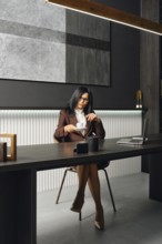 A woman in business attire sits at a sleek desk in a modern office, taking a cup of coffee. The