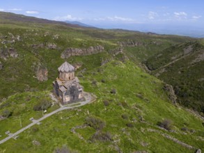 Small church on a green mountain overlooking a valley, aerial view, Church of the Mother of God,