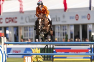 Willem Greve of the Netherlands, riding Pretty Woman Van't Paradujs, competes in the first round of